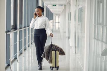 black-woman-with-suitcase-airport