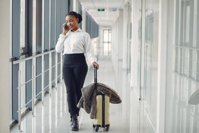 black-woman-with-suitcase-airport